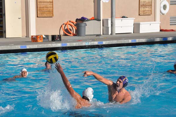 Senior Cameron Yates throws the ball past a Pioneer player to score one of his five goals. Photo by Carissa Chan.