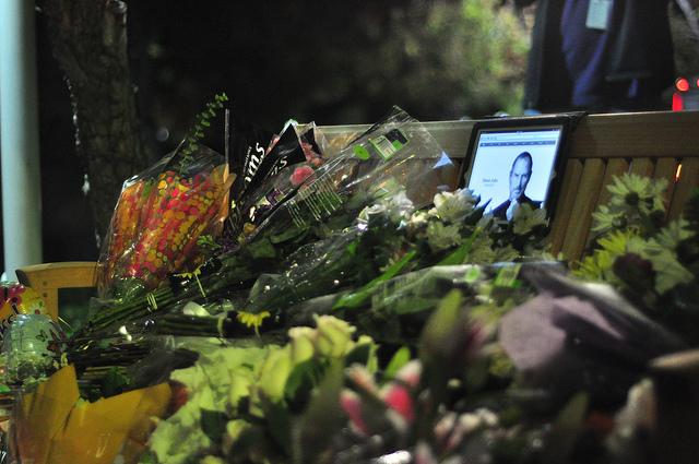 A memorial set up at Apple Headquarters honors the death of co-founder Steve Jobs on Oct. 5. His spirit and story lives on in many local citizens. Photo by Christophe Haubursin.