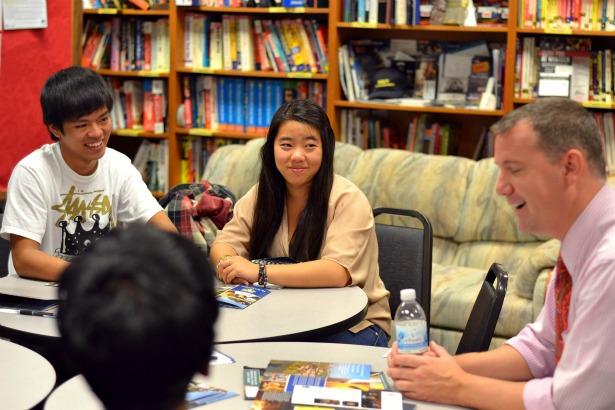 Every year, over 70 admission officers come from across the country to give MVHS students more information about their college. A University of Rochester representative Mark Wells talks to seniors Benjamin Hong and Eileen Wa and four other students about transportation, financial aid, and the curriculum at University of Rochester. College representative meetings are just one of the many events and resources that the Career Center offers. Photo by Stephanie Chang.  