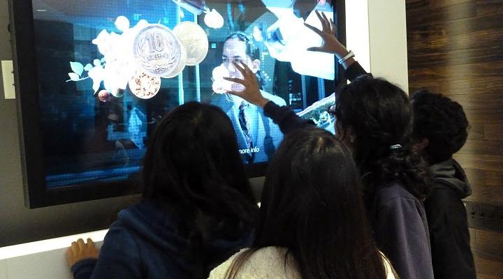 FBLA members play with touchscreen televisions at the offices of Adobe Systems on Dec. 8. The business club regularly tours large companies to let members experience the workplace environment. Photo used with permission of Keshav Santhanam.