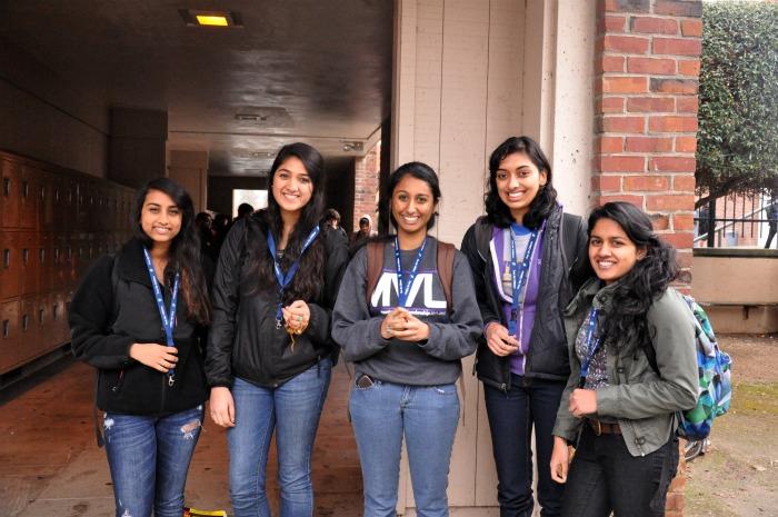From left to right, sophomores Anna Aswadhati and Samyu Sridhar and seniors Manvita Tatavarthy, Suruchi Salgar and Janani Prasad with the lanyards they plan to sell to raise money for their DECA community service project. They plan to fundraise for the Free the Project Campaign: Brick by Brick, which helps to build schools in poor villages. The event will run from February to May. Photo by Margaret Lin.