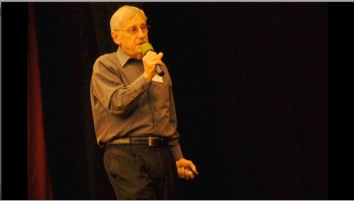 Dr. Gary Latshaw speaks about global warming in the auditorium on April 5. His presentation focused on methods to avoid global warming. Photo by Margaret Lin.