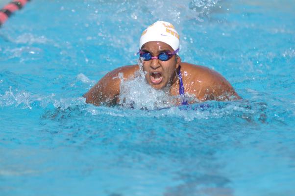 Senior Shravya Guda comes up for air during the 100-yard butterfly event. Guda finished with a final time of 1:29.78. Photo by Margaret Lin.