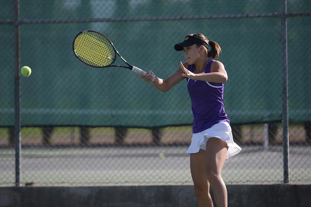 Senior Ruri Kobayakawa, then a junior, returns the ball during a game last season. Due to the great performance of the girls tennis team last season, expectations are high as the girls enter yet another season. Photo from El Estoque archives.