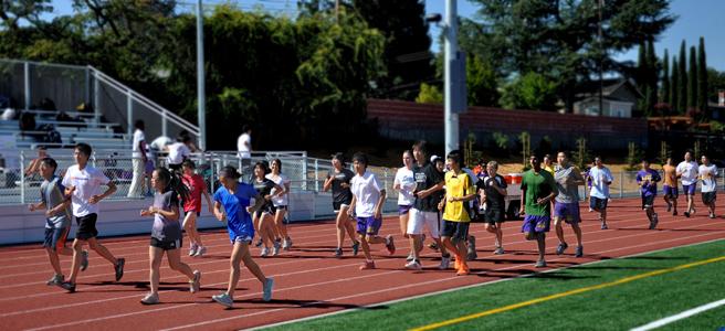 The cross country team practices after school on Sept. 11 on the new track. This year, head coach Kirk Flatow plans to implement pack running into the team’s overall strategy. Photo by Margaret Lin.