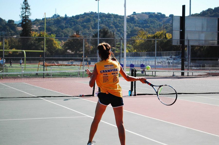 MVHS sophomore Angella Qian returns a shot by PAHS senior Sammy Solomon. Qian used strong volleys and returns to win 6-0, 6-0. Photo by Varsha Venkat.