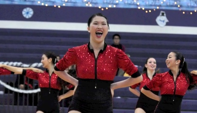 Dance team member poses during a routine.