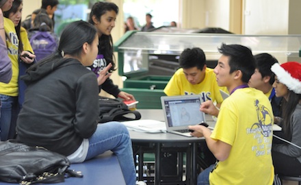 Junior Donovan Phua (right) chats with junior Karen Tseng at first day of the Link freshman finals study session on Dec. 3. All 120 Link Leaders have signed up to tutor freshman in preparation for finals, which begin Dec. 18. Photo by Margaret Lin.