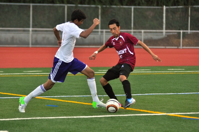 Midfielder senior Rohit Mukerji dribbles the ball past a FHS defender. The Matadors won 1-0, handing the Firebirds their first loss. 