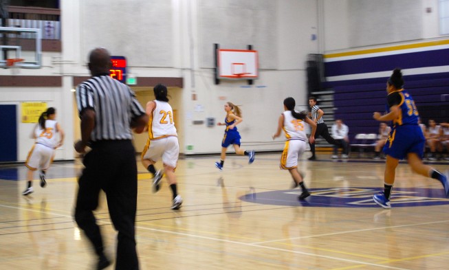 Lady Mats race across the court to keep the Santa Clara Bruins from scoring. Photo by Catherine Lockwood.  