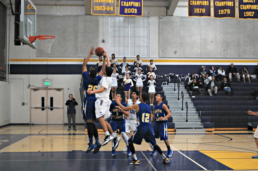 Junior Ramana Keerthi blocks a shot during Monta Vista’s game against Santa Clara on Jan. 8. Despite a strong defensive effort, the Matadors lost 45-35 against the Bruins. Photo by Robert Sulgit.