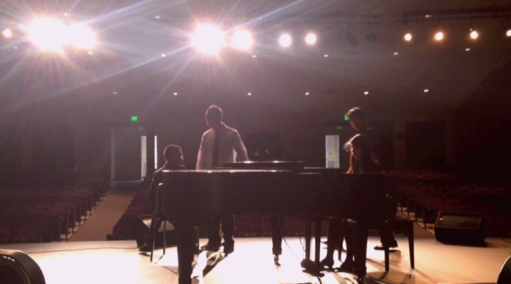 Performers prepare for the Heart Beats concert. The event held on March 23 at the auditorium included performances from violinists, cellists, flutists, and vocalists. Photo by Shuyi Qi. 