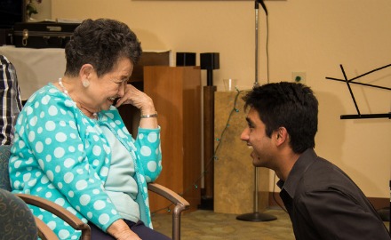 Senior Aneesh Prasad converses with a Sunny View Resident during Senior Senior Prom. Students and residents were able to exchange stories about life experiences and music. Used with permission of Clark Lin.
