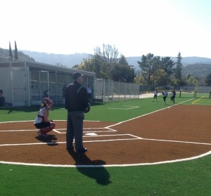 Catcher senior Kalani Seaver prepares before the bottom half of the 4th inning of the home game against Los Altos on Mar. 12. The team struggled with their offense and LAHS pitched a no-hitter. Photo by Karen Feng.