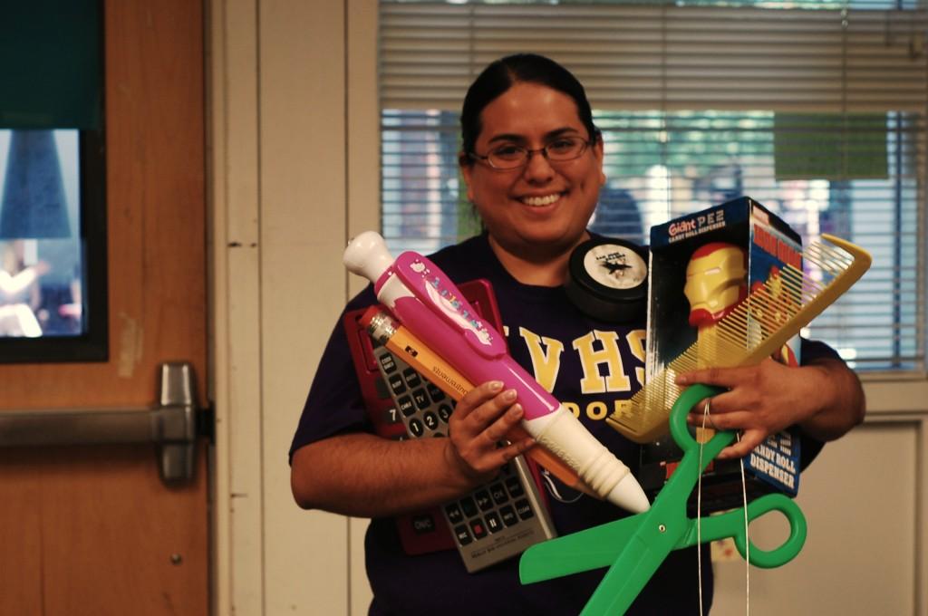 M-H shows her oversized items that she keeps around the classroom. Her collection is an accumulation of student gifts and personal purchases. Photo by Smitha Gundavajhala.  