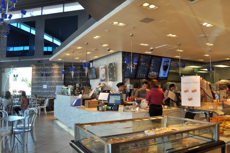 Waiters at the Paris Baguette don pinstriped Parisian clothing as they cash orders and serve drinks. Paris Baguette strives to incorporate the same French authenticity into its food and setting. [Photo by Harini Shyamsundar.]