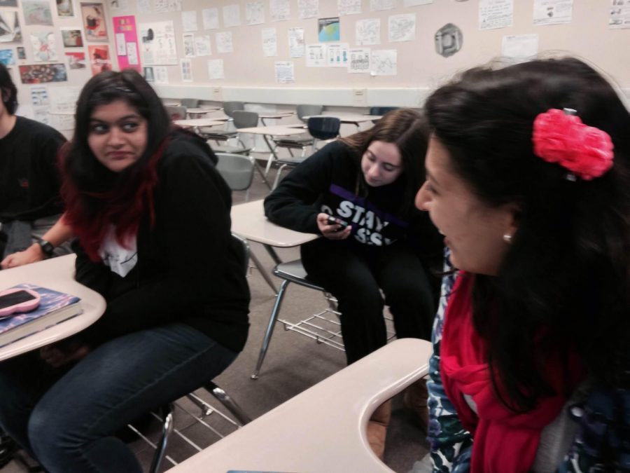 Senior Anisha Pathak talks to fellow club member junior Aditi Soin.