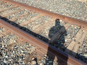 “It’s my shadow self!” said Jane. “This is where I used to lay every morning.” Beneath the early afternoon sun, Jane bends over the railroad tracks that once haunted her. 
