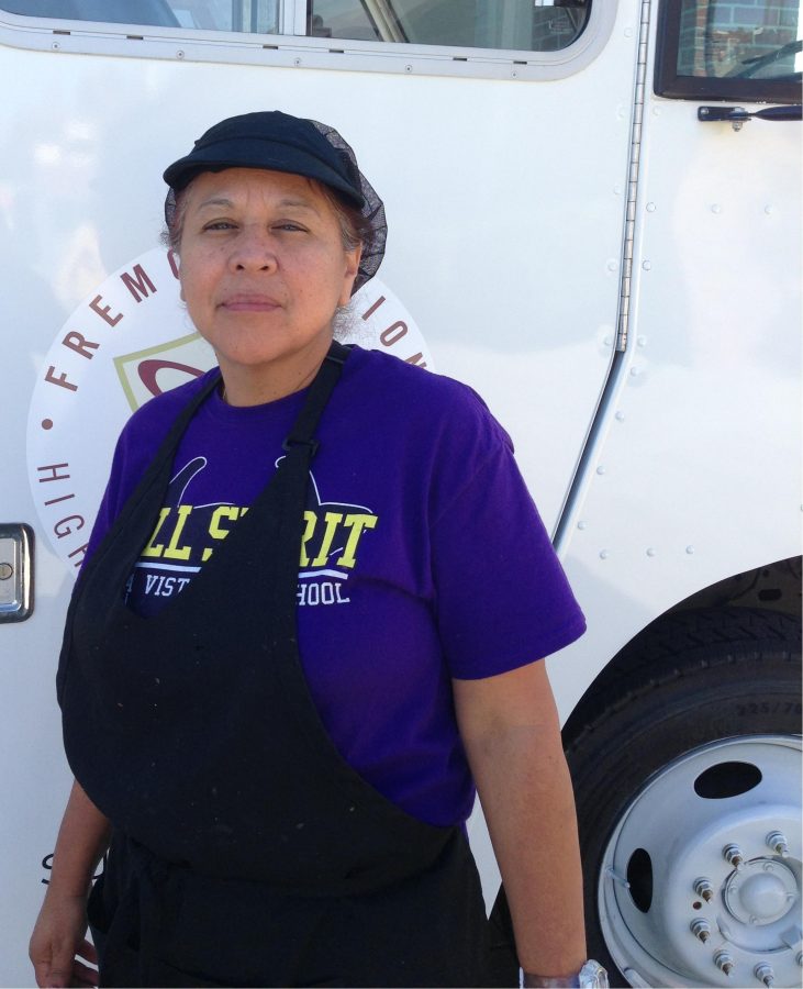 New Food Services supervisor Debbie Herrera stands in front of a food truck. Lunch is temporarily being served from the trucks while the cafeteria undergoes construction. Photo by Lydia Seo.