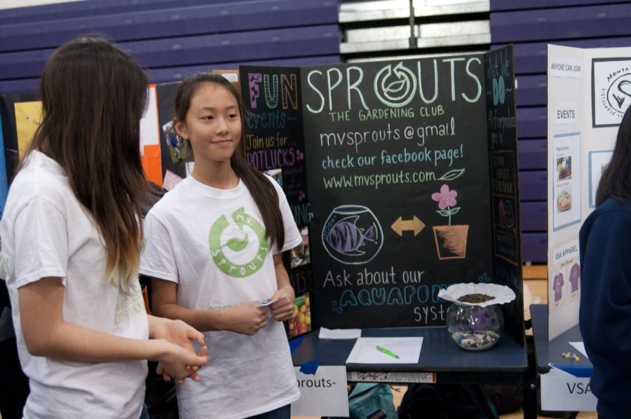 MV Sprouts officer sophomore Ada Chen greets the student body to present the club. The plant in front of the stand is from the Matador Meadow. Photo by Catherine Lockwood.