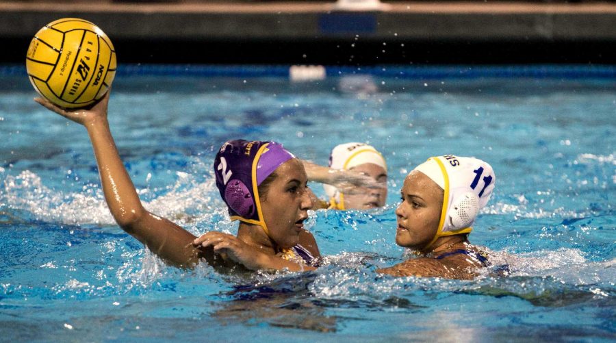  Senior Samantha Quevedo looks to make a pass with a Santa Clara player defending her on September 16. Quevedo made a shot from the center line but her and the rest of the Matadors efforts proved not to be enough as MVHS lost their season opener 14-10. Photo by Colin Ni.
