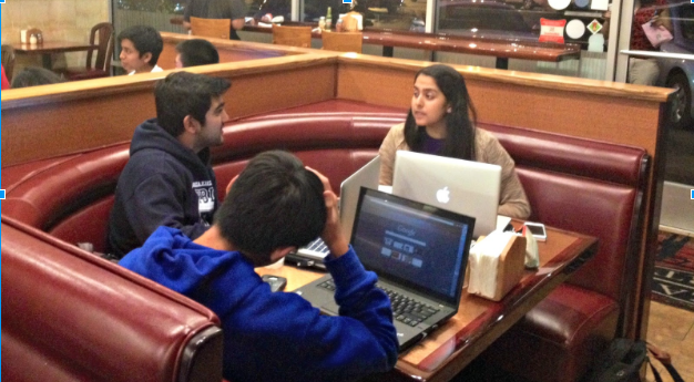 FBLA officers senior Neil Gupta and senior Priyanka Achalu chat and do homework at a Pizza My Heart booth. Officers were present throughout the event from 4:00 to 9:00 PM on Oct. 21. Photo by Malini Ramaiyer.