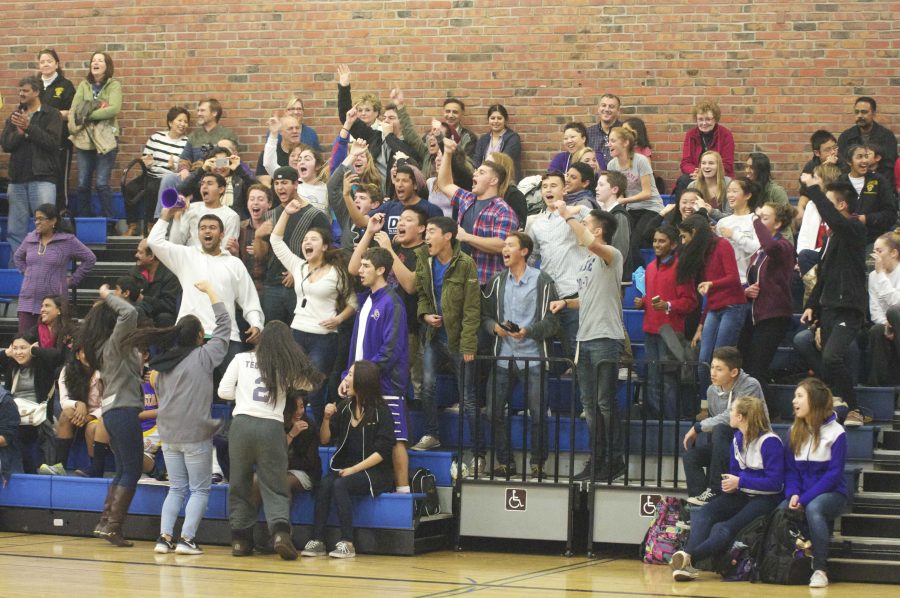 MVHS fans cheer in the last minutes of the boys basketball game. MVHS was down 55-52 and as time ran out, fans grew louder to encourage their team. Photo by Malini Ramaiyer. 
