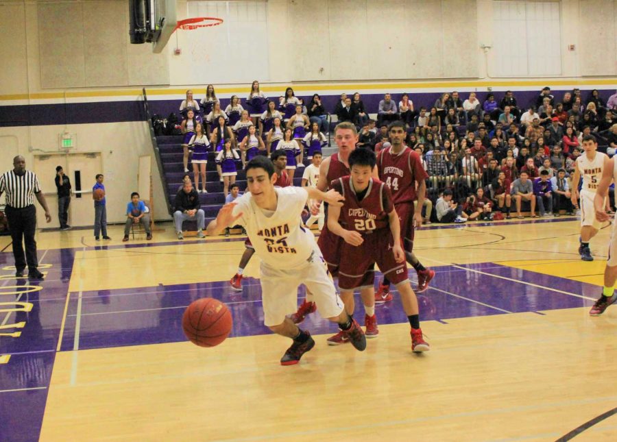 Junior Mark Geha scrambles to recover a loose ball. Photo by Justin Kim.