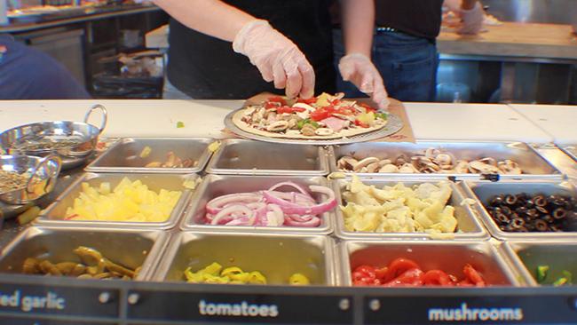 Assembly line at MOD. MOD Pizza is completely customizable, similar to Chipotle. 