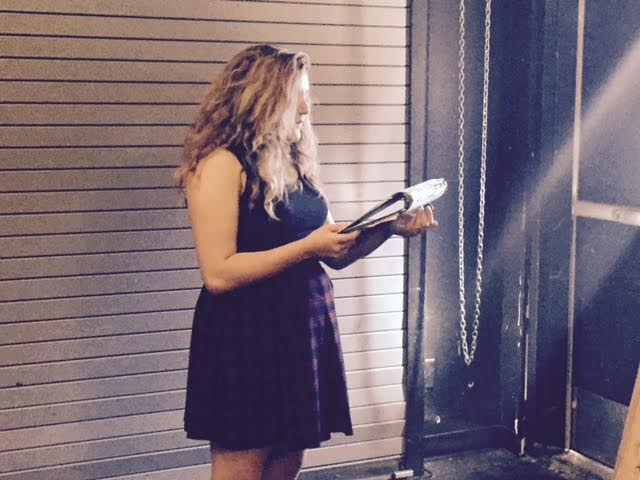 Sophomore Natalie Standridge proceeds to memorize her lines in the corner of room F104. 