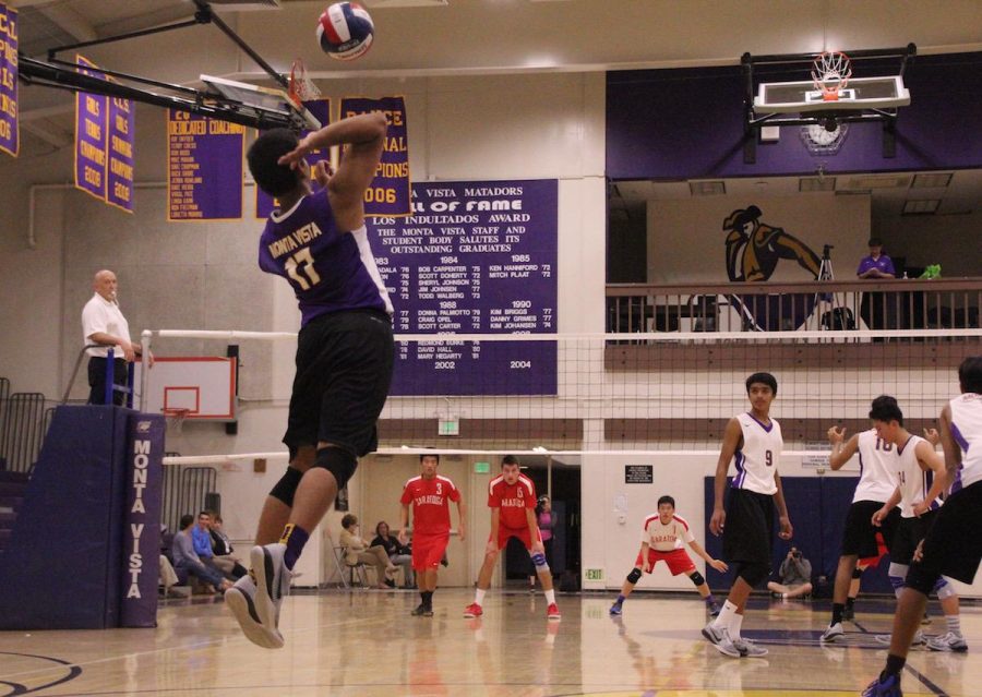 Junior Prathik Rao jumps as he serves the ball to SHS. Although MVHS struggled with missed serves early on, they defeated the Falcons.