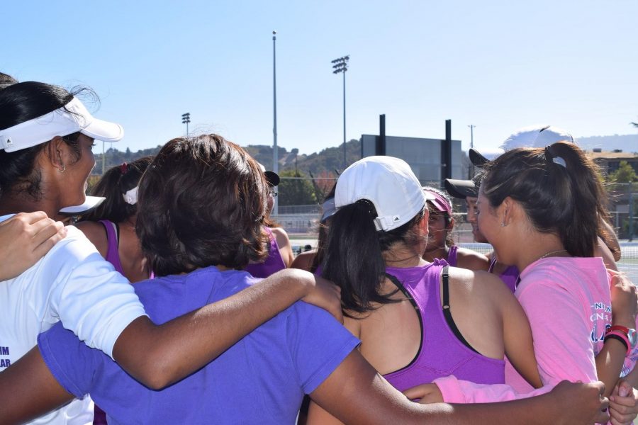 Team huddles together before the match.