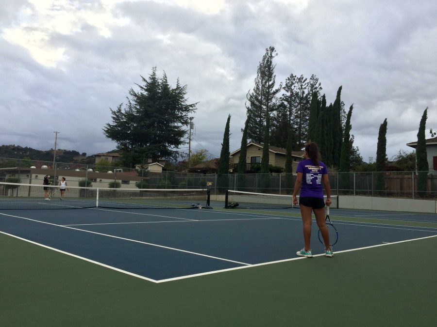 Freshman Meera Bamboo waits for her doubles partner, sophomore Tanya Ravichandran to serve.