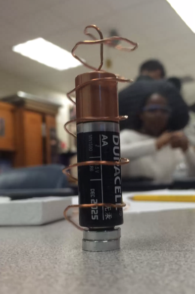 Spinning homopolar motors teach Science National Honor Society members about electromagnetism