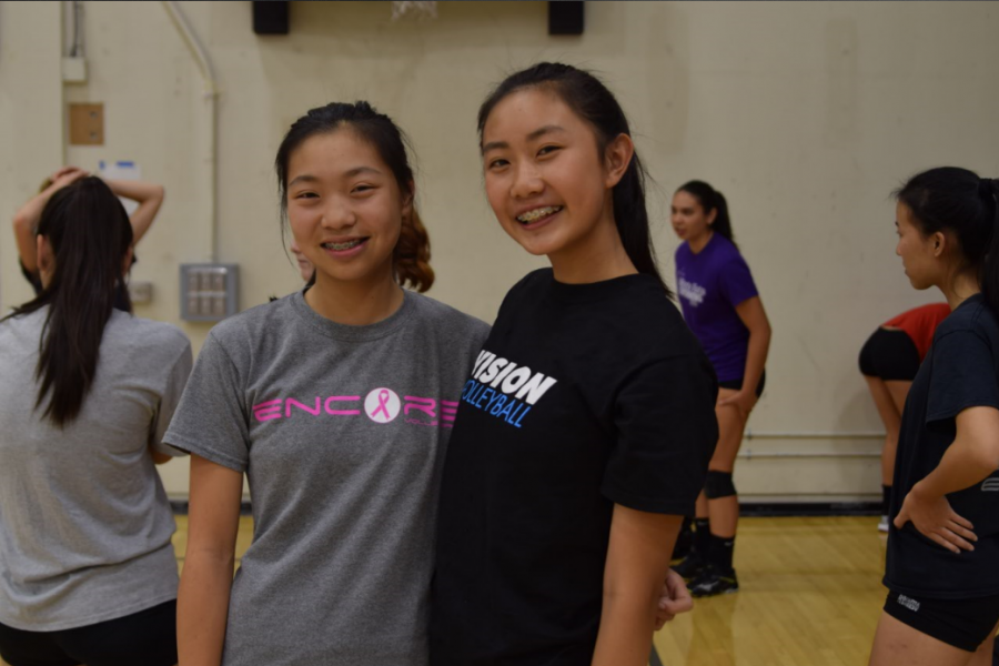 Freshmen Sammi Dunn (left) and Jackie Cai (right). Two new members of the MVHS girls volleyball team posed together before warm ups. Photo by Maggie McCormick.