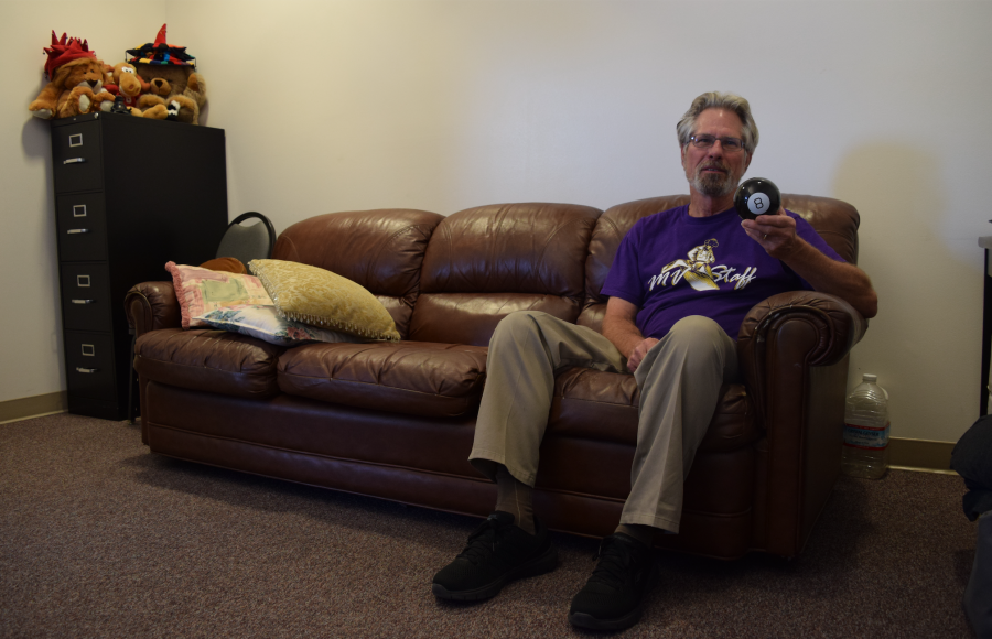 Mr. Prinz sits on the couch in his room. Photo by Om Khandekar 