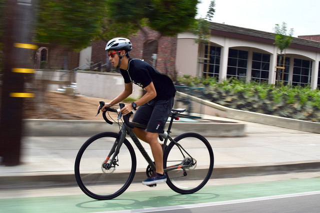 Senior Justin Lin bikes along McClellan Road in front of MVHS. Lin bikes recreationally. Photo by Om Khandekar.