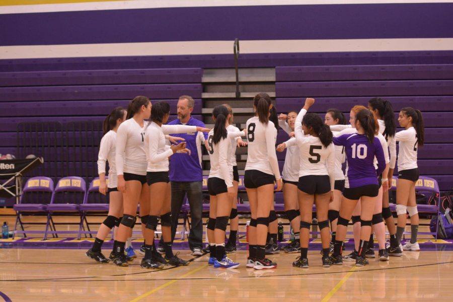 MVHS puts their hands in as they celebrate their win against Saratoga.
