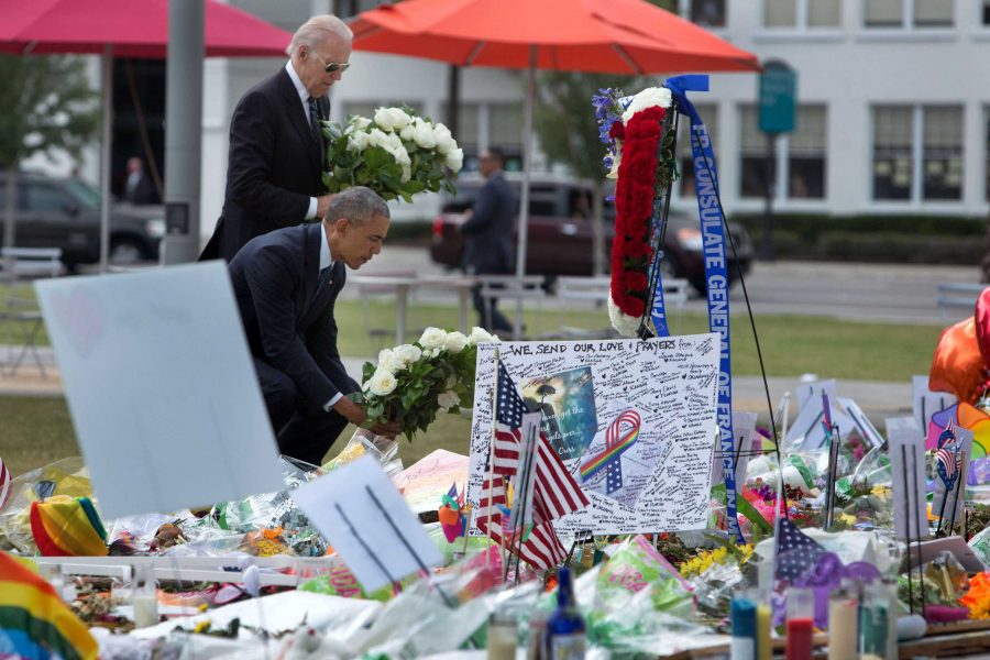 President Barack Obama and Vice President Joe Biden place bouquets of flowers at a memorial for the victims of the terrorist attack at the Pulse nightclub, at the Dr. Phillips Center for the Performing Arts in Orlando, Fla., June 16, 2016. (Official White House Photo by David Lienemann)