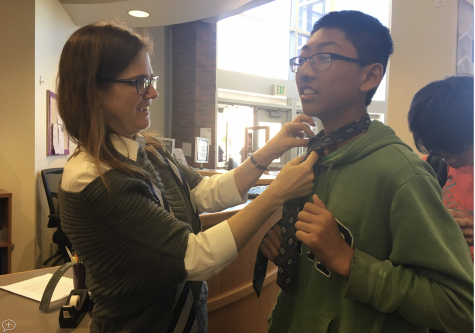 Library staff holds a tie tying tutorial