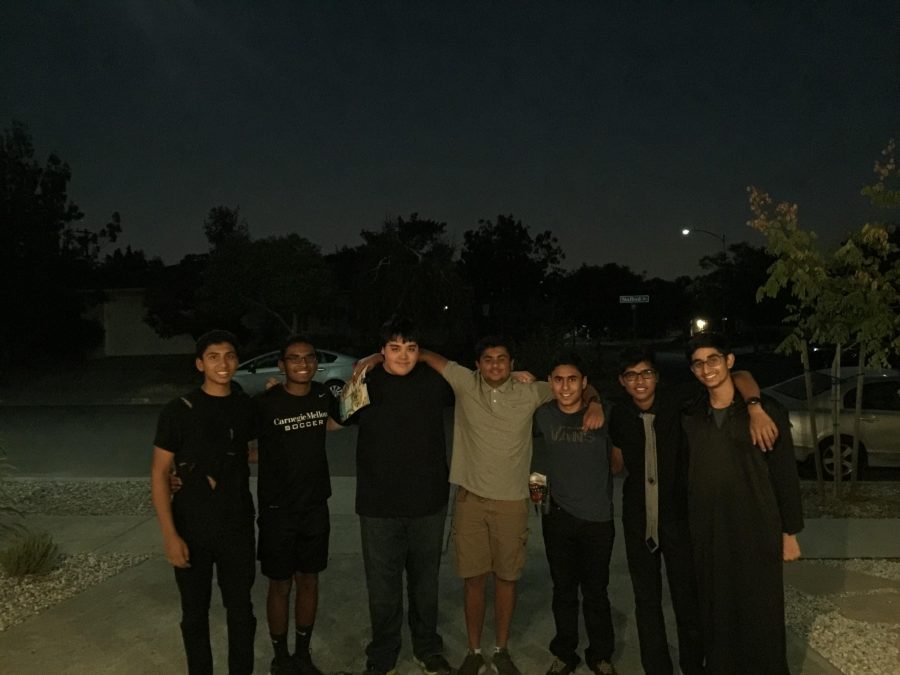 On Halloween night, the 7 boysi smile for a picture after putting in hours of hard work on this project. Photo by Sreya Kumar