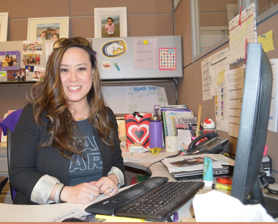 Lam poses at her desk in the MVHS guidance office. Lam was one of the winners of the 2018 Employee of the Year awards. Photo by Maggie McCormick.