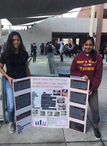 Sophomore Ramya Chamkeri and her partner stand with their Synopsys Science Fair Championship research project in the rally court. Chamkeri’s project won an award in the annual Synopsys fair Championship. Photo courtesy of Ramya Chamkeri. 
