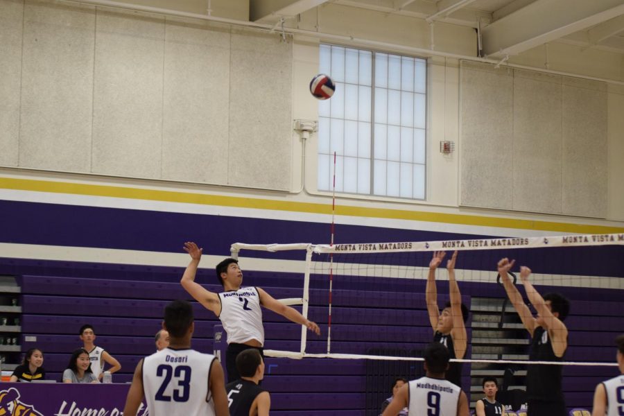 Junior Charlie Yi prepares to spike the ball against CHS. The Matadors won their 22nd game in a row.