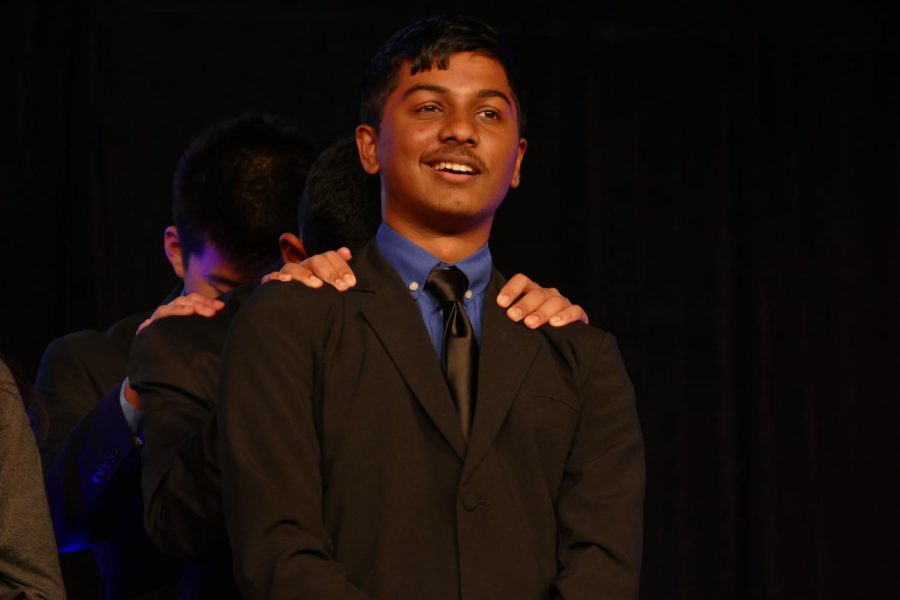 Junior Daniel Duan, junior Ruchil Saha, and freshman Nikhil Sathye wait on stage for their placement in their competition to get announced. Photo courtesy by Ethan Lin.