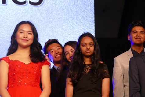 Junior Ethan Lin, junior Pratya Poosala, and freshman Marissa Jensen stand on stage as they wait for their first place to get announced. Photo courtesy by Ethan Lin