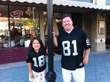 My dad and I when I was younger, matching in Raider gear often. We took this photo because our numbers were the opposite of each other. 