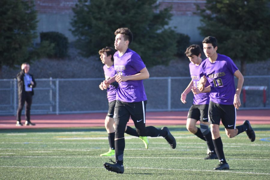 Senior+Noah+Rizk+and+teammates+jog+back+after+Rizk+scores+his+second+goal.+Photo+by+Collin+Qian