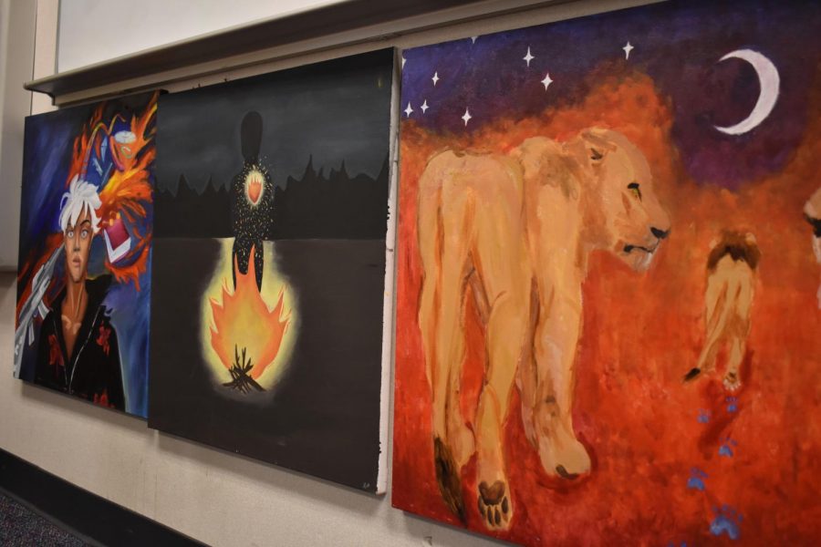 Paintings from a World Literature project line the front of literature teacher Jireh Tanabes classroom.