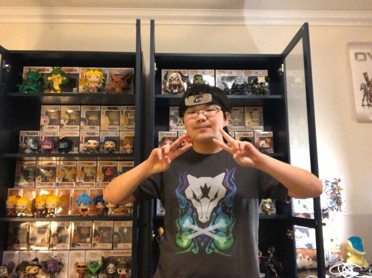 Sophmore Collin Ong poses in front of his Funko Pops. Ong has over 70 Funko Pops. Photo used with permission of Collin Ong

